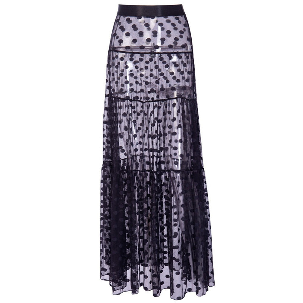 Transparante lange damesrok met stippenpatroon. Trendy zomerrok voor strand of elegante gelegenheden, hoge taille.