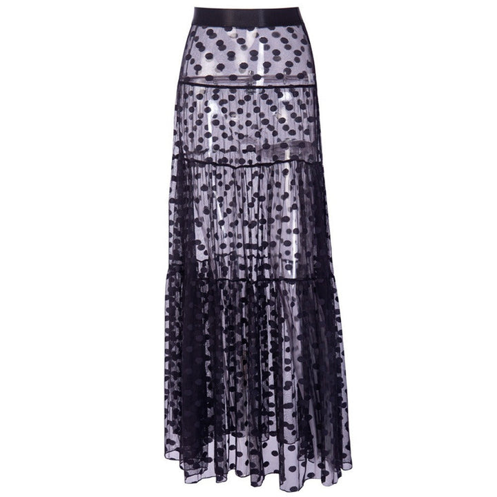 Transparante lange damesrok met stippenpatroon. Trendy zomerrok voor strand of elegante gelegenheden, hoge taille.
