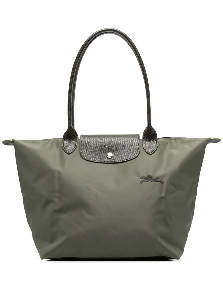 Compact opgevouwen praktische handtas, makkelijk mee te nemen in koffer of grote tas voor onderweg.