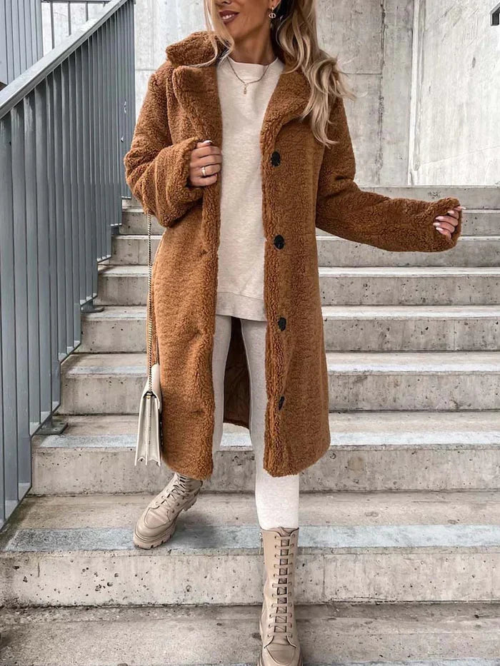 Warme damesjas: lange teddy winterjas, zacht en knus, voor winterse dagen.