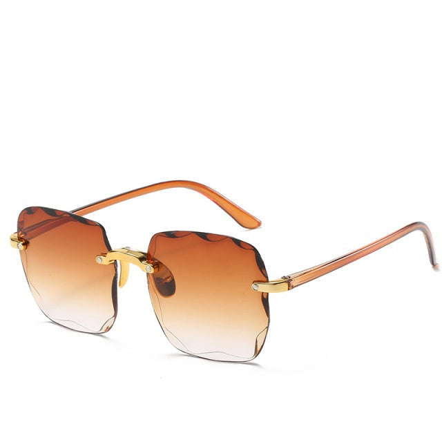 Trendy vierkante randloze dames zonnebril in vintage stijl met UV400-filter. Stijlvol zomer accessoire.